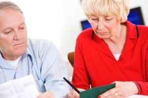 older couple looking worried