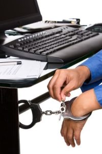 Unlocking the handcuffs that tied the hand to the work desk.