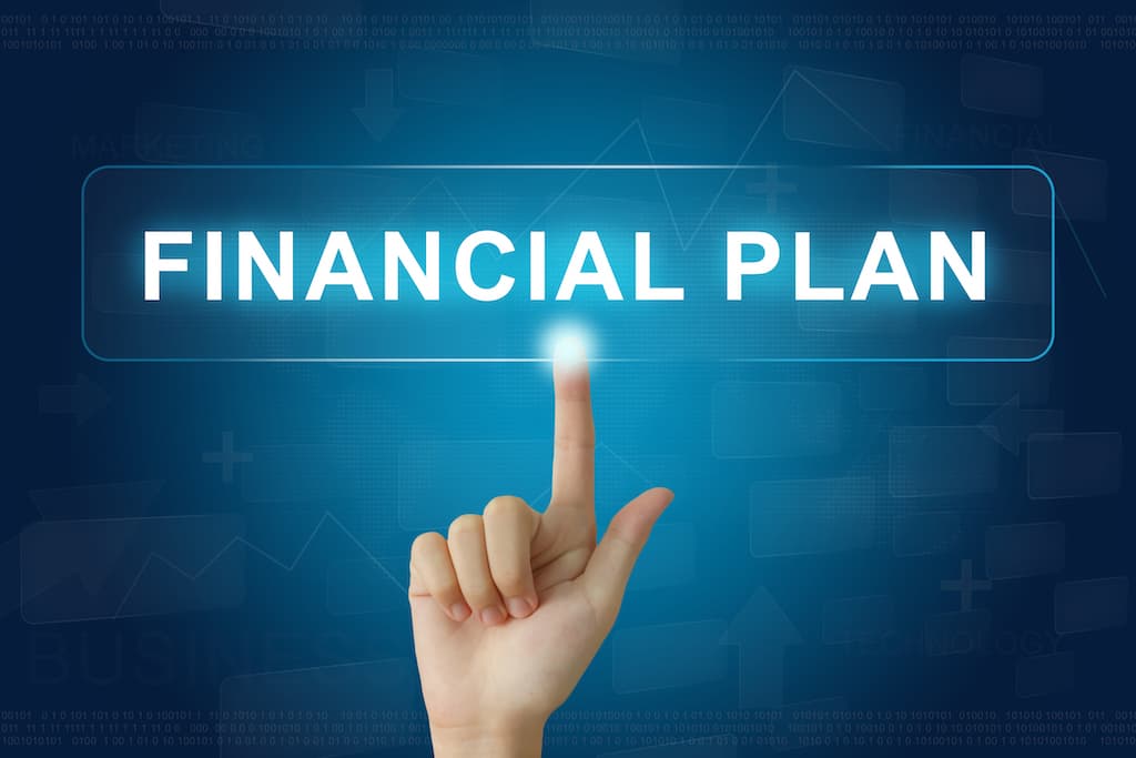 financial-planning-finger-pointing-on-electronic-board 
