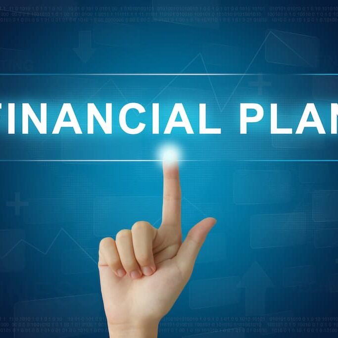 financial-planning-finger-pointing-on-electronic-board